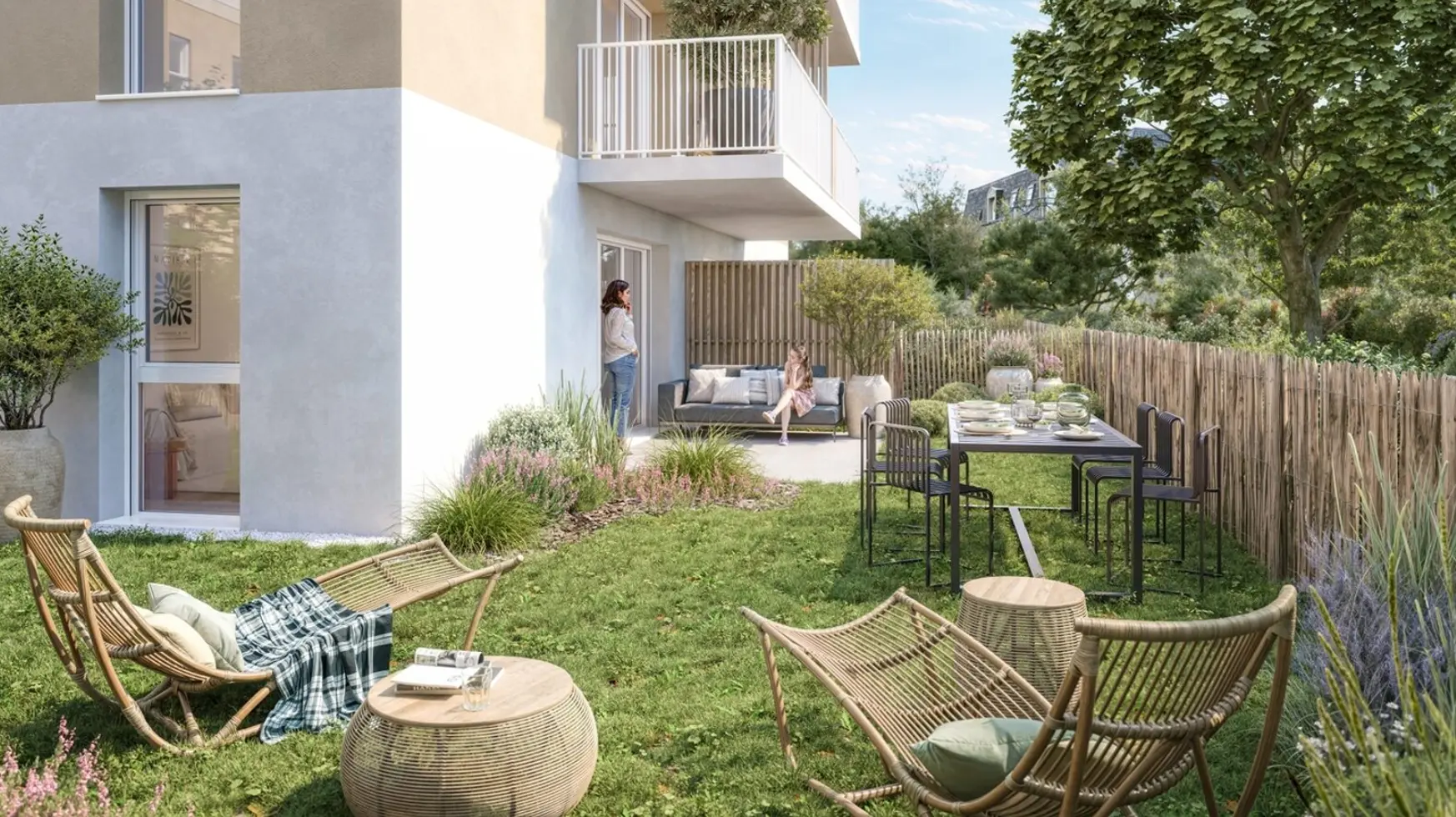 Vue du programme immobilier neuf Plaisance à Paimpol : jardin privatif meublé au pied d'une résidence claire à balcons
