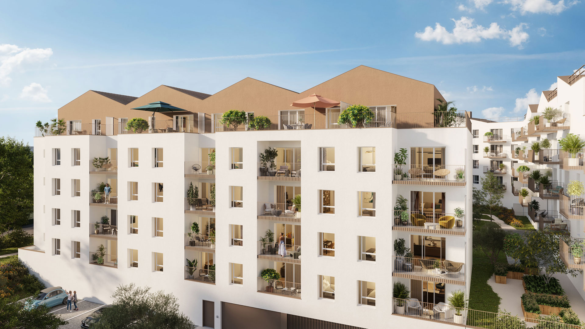 Vue du jardin paysager du programme immobilier neuf Les Jardins du Coteau à Quimper : pelouses, arbres et terrasses privatives