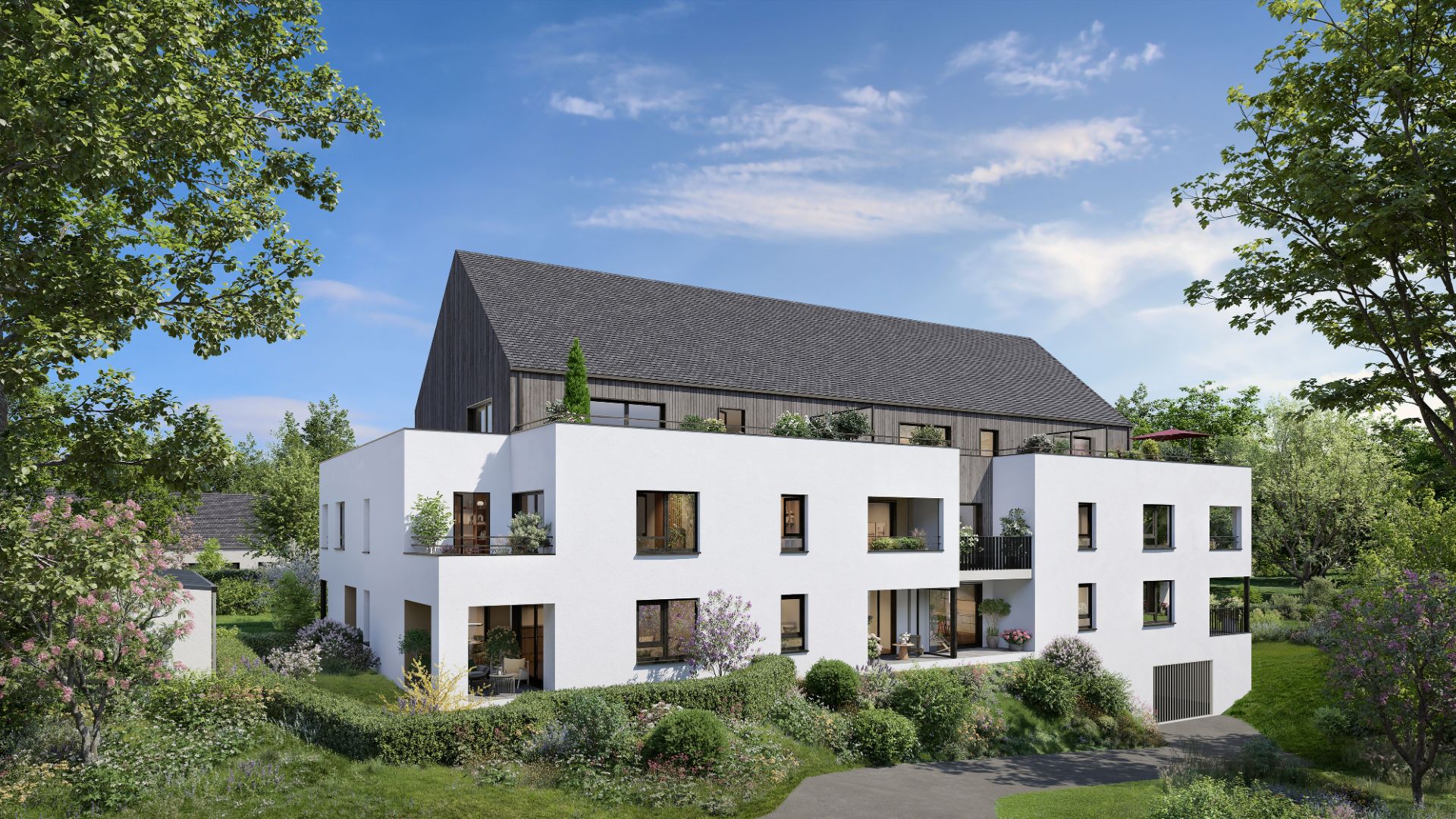 Perspective du programme immobilier neuf Fleur d'Ô à Guérande : bâtiment clair à taille humaine dans un cadre paysager