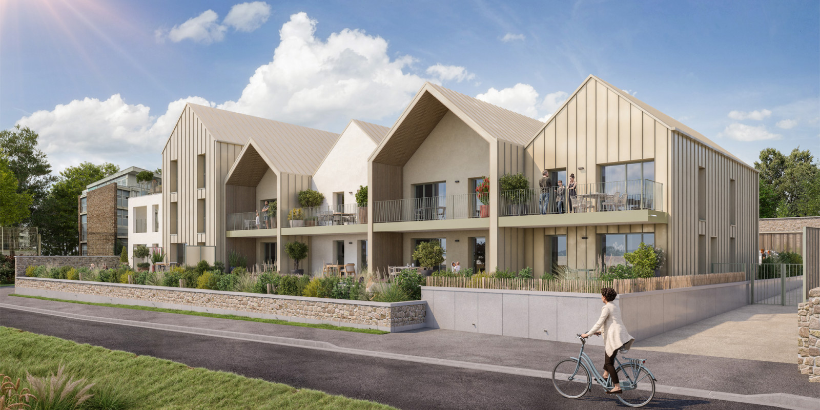 Perspective du programme immobilier neuf Les Jardins de Kerroc'h à Paimpol : façades claires, balcons et jardins paysagers