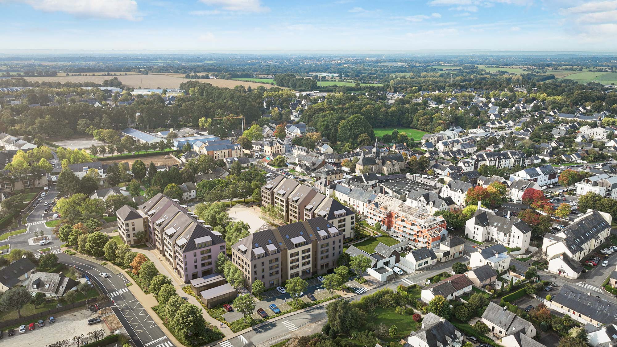 Visuel officiel du programme immobilier neuf An Diskuiz à Pacé : nouveaux immeubles insérés dans le cœur de bourg vus depuis le ciel